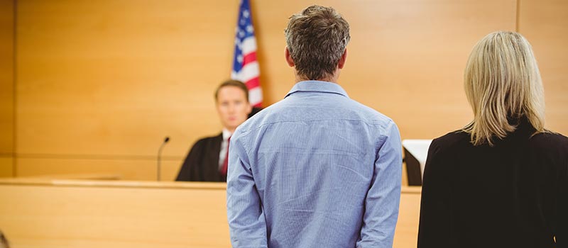 Man Being Sentenced by Judge