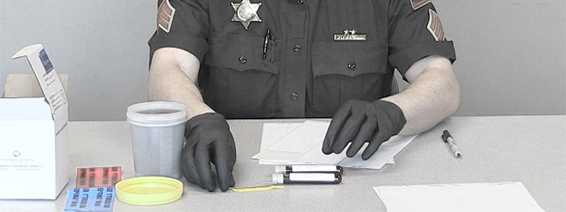 Cop Labeling Blood Test Vials